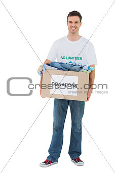 Smiling man holding donation box