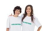 Two cheerful volunteers standing