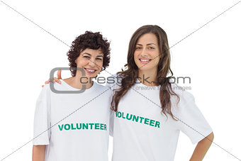 Two cheerful volunteers standing