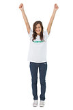 Woman wearing volunteer tshirt raising her arms