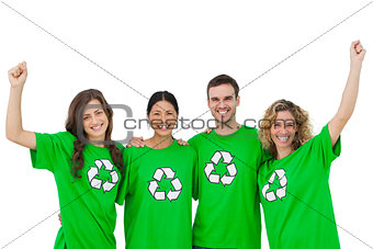 Smiling group of environmental activists raising arms