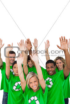 Cheerful group of environmental activists raising arms