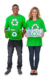 Two environmental activists carrying box of recyclables