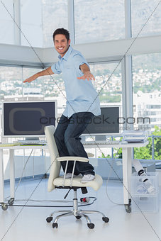 Creative designer surfing his swivel chair