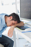 Graphic designer sleeping on his keyboard