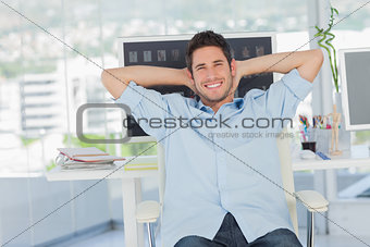 Cheerful creative business employee resting