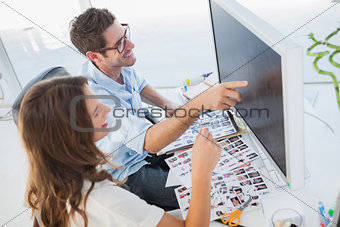 Attractive photo editors working on computer