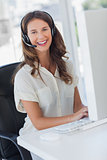 Cheerful businesswoman wearing a headset