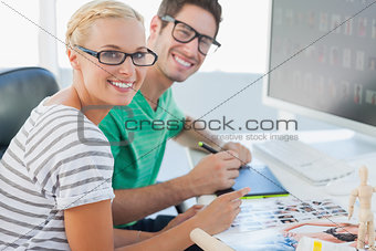 Attractive photo editors working together