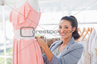 Fashion designer working on dress