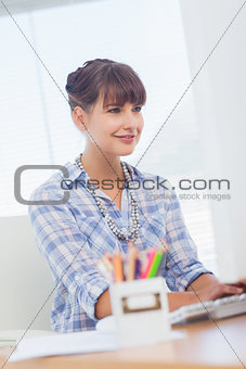 Pretty designer working on her computer
