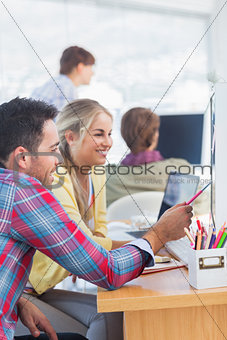 Cheerful designers working together on their office
