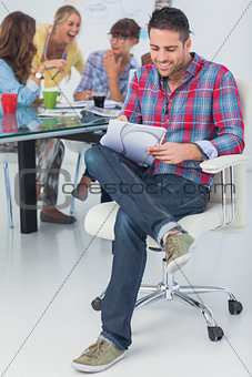 Smiling designer working in his office