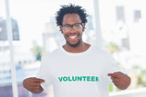 Handsome man pointing to his volunteer tshirt