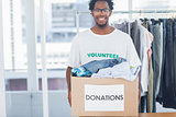 Attractive man holding a donation box