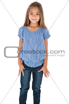 Cute little girl standing and smiling at camera