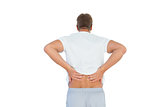 Muscled man suffering from back pain