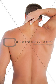 Shirtless man with shorts having a neck ache