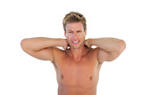 Shirtless man yelling and suffering from neck pain