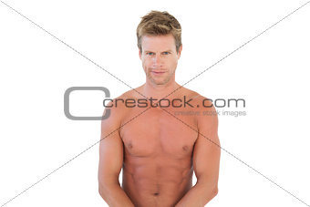 Handsome shirtless man flexing muscles