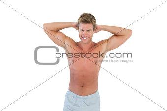 Shirtless man with hands on head