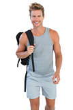 Man in sportswear holding rucksack