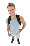 Attractive man in sportswear with hands on hips