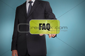 Businessman selecting green label with faq written on it