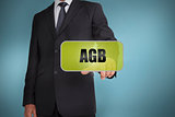 Businessman selecting green label with agb written on it