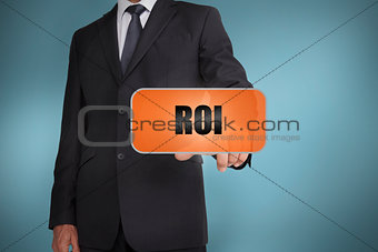 Businessman selecting orange tag with roi