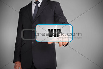 Businessman selecting tag with vip written on it