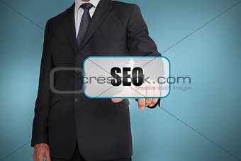 Businessman touching tag with seo written on it
