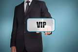 Businessman touching tag with vip written on it