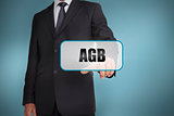 Businessman touching tag with agb written on it