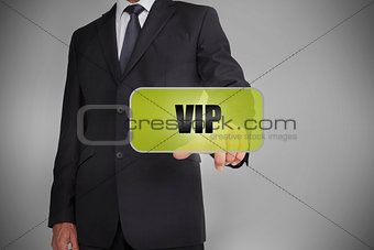 Businessman selecting green tag with the word vip written on it