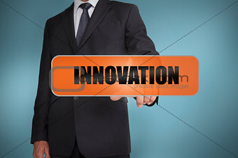 Businessman touching the word innovation