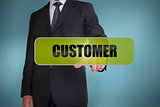 Businessman touching the word customer written on green tag