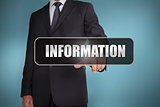 Businessman touching the word information written on black tag