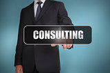 Businessman touching the word consulting written on black tag