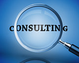Magnifying glass showing consulting word