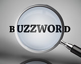 Magnifying glass showing buzzword word