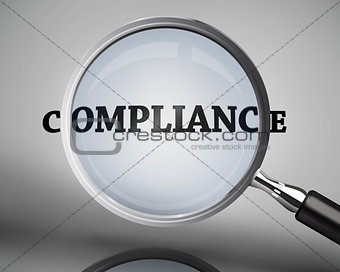 Magnifying glass showing compliance word