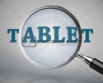 Magnifying glass showing tablet word