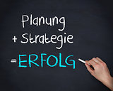 Man writing planung strategy and erfolg