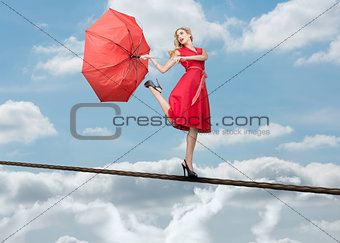 Pretty woman standing over the clouds