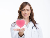 Doctor holding a pink heart