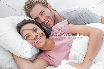 Couple laughing and looking at camera