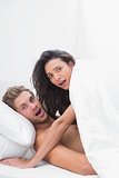 Couple caught in the act in bed
