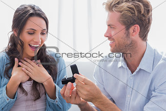 Man offering an engagement ring to his partner