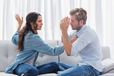 Upset woman about to slap her partner